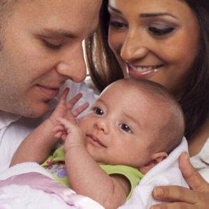 Parents holding their baby