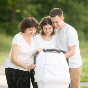 Family looking down at pram